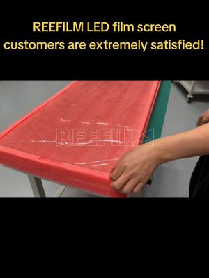 A post by @reefilm_display on TikTok caption: REEFILM LED film screen customers are extremely satisfied! #china #ledwall #glass #ledscreen #reefilm #leddisplay #hottest #transparent #install #panel #ledfilm 