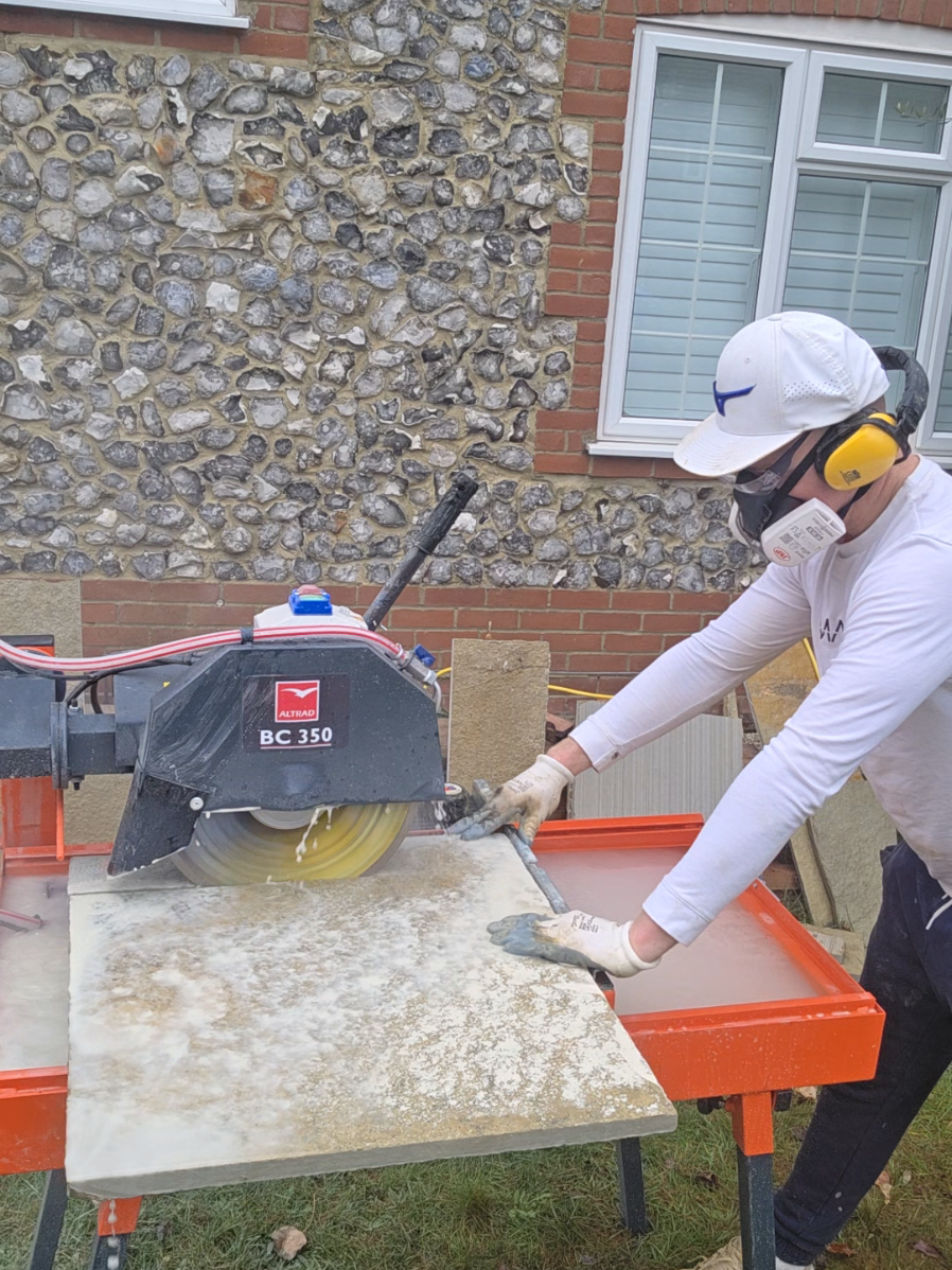 A post by @bricksandslides on TikTok caption: how i cut my slabs #foryou #bricklayer #bricklaying #cutting #garden #foryoupage @Altrad Belle 