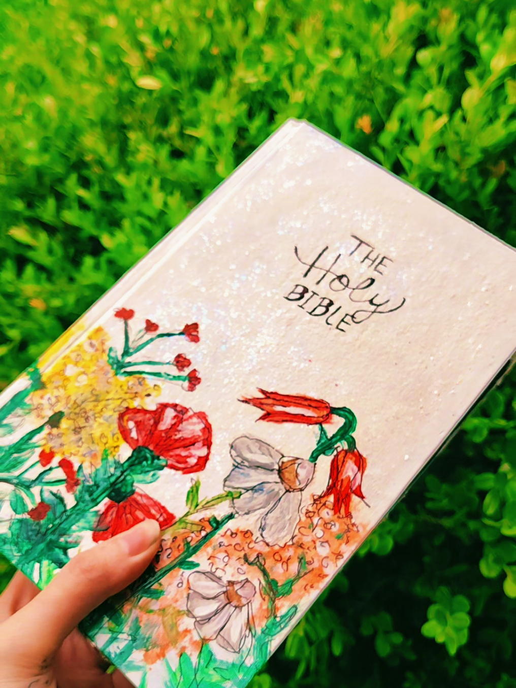 A post by @inkdm0m on TikTok caption: Idk who this one is for. I usually just give them away. It took a lot of paint to get this Bible white as it was originally a black covered Bible. I didn't really like the way it was turning out, but it's started to grow on me. 🥀#paintedbible #tattooedchristian #christiantiktok #foryoupage 