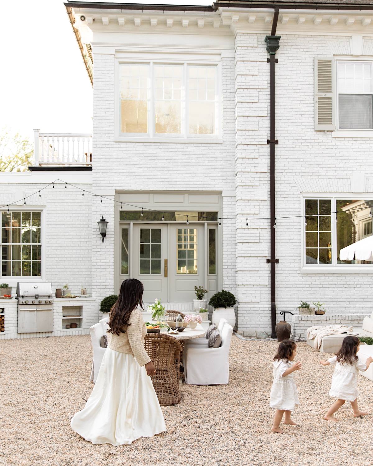 A post by @nabela on TikTok caption: It all started with a trip to the south of France, while I was knee deep in acquiring this property. The romance of the European countryside was something I knew I wanted to infuse into our space, from the inside out…loose pebbles, soft tones, a blend of textures with a touch of antiques & vintage — it’s starting to feel like home. Swipe to see the transformation.  I’m so grateful to have had your support in my Couryard Project series. Onto the next adventure in our new, old home. 🤍