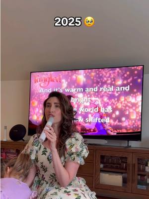 A post by @laurenpaley on TikTok caption: Still singing the same songs with my girl 🥹 she’s just so much bigger now! #rapunzel #tangled #disney #disneyprincess @Disney @Disney Music @Disney Studios 