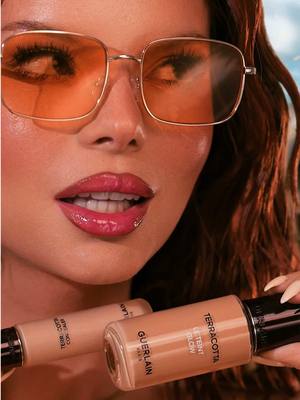 A post by @anastasile on TikTok caption: Summer makeup mood with my faves from @Guerlain 💞 The foundation and concealer melt into the skin but still set with that soft glow I love ✨🙌🏻 Wearing blush in shade 06 Deep Red ❤️ bronzer in 03 Medium Warm ☀️ and their honey lip oil in 458 Rose Glow 💅🏼🍯 obsessed 🔥 #guerlainlover #guerlainmakeup #terracotta #glowymakeup 