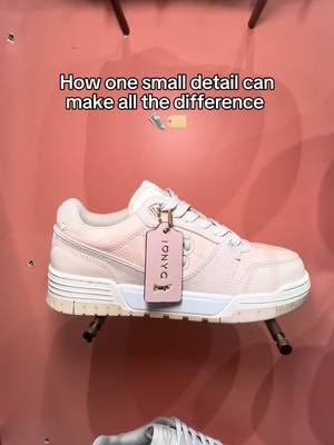 A post by @coach on TikTok caption: From clean to custom with the simple addition of a Coach hangtag! 🏷️ Would you add a hangtag to your sneaker? #CoachNY #Accessorizing #SohoSneaker 