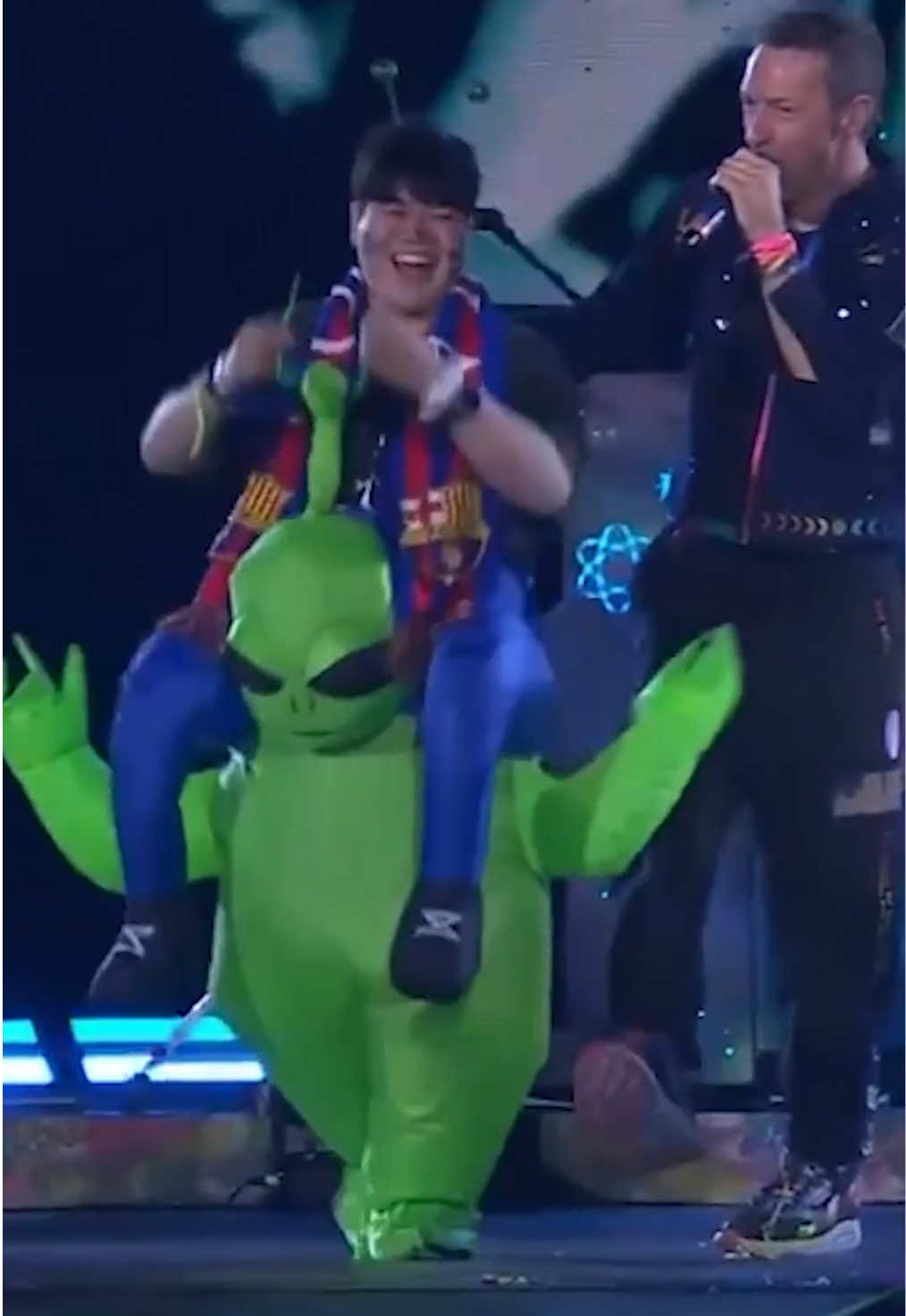 A post by @coldplay on TikTok caption: 👽🥹💚🩷 #ColdplaySeoul 