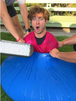 A post by @topperguild on TikTok caption: Coke and Mentos vs Giant Balloon!