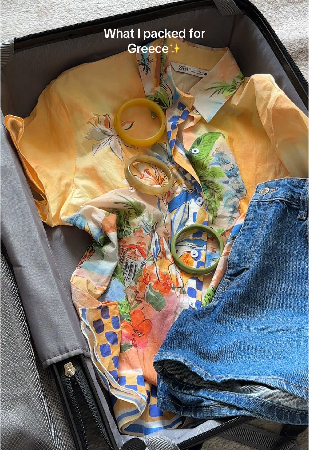 A post by @stephaniethemuse on TikTok caption: Pack with me🏖️ #ootd #outfitideas #summeroutfits #holidayoutfits #packwithmeforvacation #greecetravel 