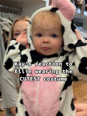 A post by @kayandtayofficial on TikTok caption: Ellie’s little foot slaps when she was running away at the end 😂 backstory ::: we love being able to put Ellie in costumes because there’s nothing better than little baby costumes 😂whenever we see one online that we think Ellie would be cute in, we buy it and dress her up in it. Kay saw this cow costume and thought it would be so funny for Ellie to wear because she’s always running around the house doing the sign for “milk”. When it came in, she dressed it up and yelled my name so I could see the costume. Ellie was so cute as a little cow. 🐄 When they stepped out into the hallway, Ellie immediately wanted to run to the mirror to see herself. It’s always so fun dressing her up. She’s the cutest little thing. I can’t wait until we find a new costume to put her in. We love it and so does she. ❤️ #kayandtayofficial #couples #relationships #pregnant #postpartum