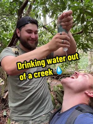 A post by @2guysandsomeland on TikTok caption: Drinking creek water! 💧 #foryou #hike #couple #nationalpark #nc 