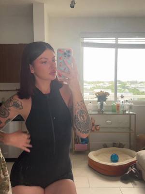 A post by @largeju on TikTok caption: Gym fit  #girlswithtattoos #legday #bodysuit #jumpsuit #gymfit 