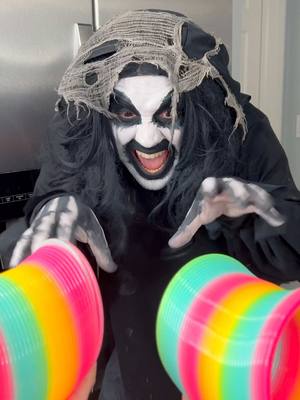 A post by @yoeslan on TikTok caption: Monster uses slinky to get candy 🤣👻 #funnyvideos #monsterundermybed 