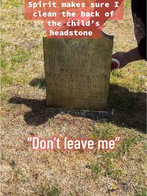 A post by @santaparanormal on TikTok caption: Spirit made sure I was cleaning the back of this child’s headstone #tiktoklive #livehighlights #paranormal #haunted #ghost #cemetery #spiritbox 