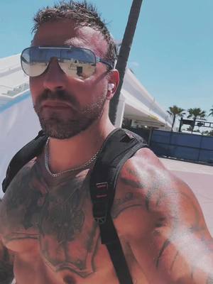 A post by @nottattedfire on TikTok caption: Beaching 🏖️ #beach #muscle #tattoos #abs #fyp #model 