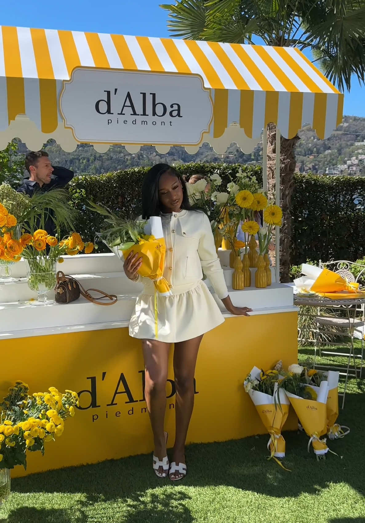 A post by @fatimabahxo on TikTok caption: Now we're going on a brand trip!! Let's fly to Lake Como with @DALBA — white truffle, found in Piedmont, Italy, is used in most of their products, so they flew us out to the source — where the brand was born #dalba #dalbapartner #dalbahood #truffleglow #dalbatrip #dalbasunscreen #dalbavita