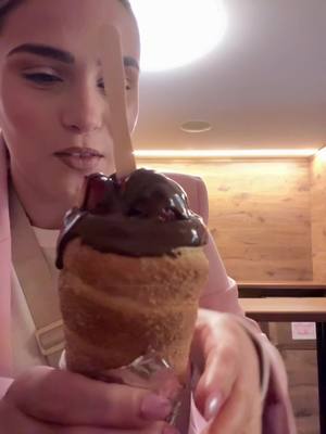 A post by @callietake2 on TikTok caption: Trying a chimley cake in Prague!!😍 #chimleycake #prague #fyp #yumm #dessert #chocolate #wow 