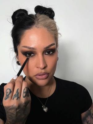 A post by @lora.arellano on TikTok caption: Easy 💨 smoke with the @meltcosmetics  Melt it liquid shadows in “Nudist & Nightswim”  Used the black onyx pencil in the waterline 🙌🏽 #meltcosmetics #makeupartist #alttok #smokyeye #makeuptutorial #alttiktok #altmakeup #smokyeye 