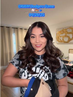 A post by @mya5 on TikTok caption: Did I pick the right fit? 😩 #dodgers #grwm @MontoyaTwinz 