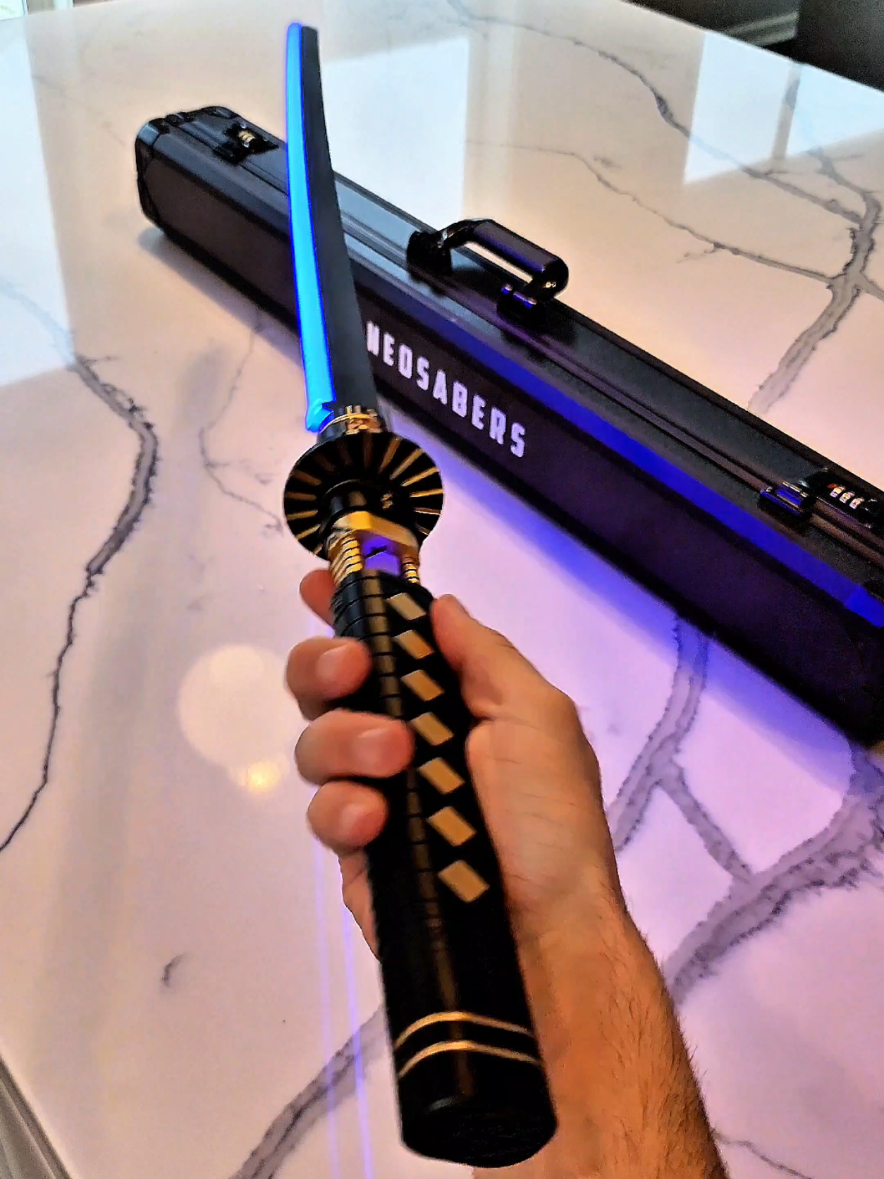 A post by @nomad.props on TikTok caption: why does Hanz Zimmer always go so hard?! #unboxing the #Shogun #lightsaber from @Neosabers  I would love to see this type of saber in #TheMandalorian it would fit right in with the Kurosawa vibes!