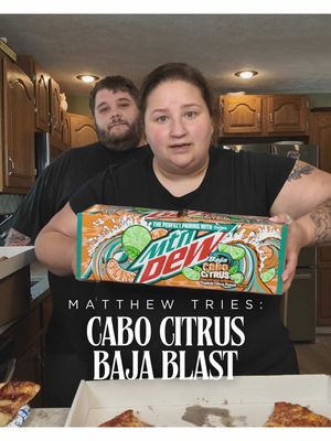 A post by @applesauceandadhd on TikTok caption: Tonight on Matthew Tries, it’s Baja Blast Cabo Citrus, aka “grown-up soda” that our daughter really wanted until she found out it’s not Sprite. (Spoiler: it’s not even close.) I don’t usually do Matthew Tries with kids awake, but it’s pizza night, I wanted a pop, and honestly? Sue me. #MatthewTries #BajaBlastButMakeItBoozy #NotSpriteSorry #PizzaNightVibes #GrownUpSoda #MomNeedsAPop #PassiveAggressiveParenting #TasteTestChaos #HeDidNotSeeThatComing #DoneIsBetterThanPerfect