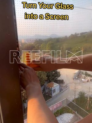 A post by @reefilm_display on TikTok caption: A piece of shop window glass can also become an eye-catching screen. ✔️High transparency without blocking light  ✔️Dynamic visuals that stop people in their tracks #ledfilm #panel #install #transparent #hottest #leddisplay #reefilm #ledscreen #ledwall #china 