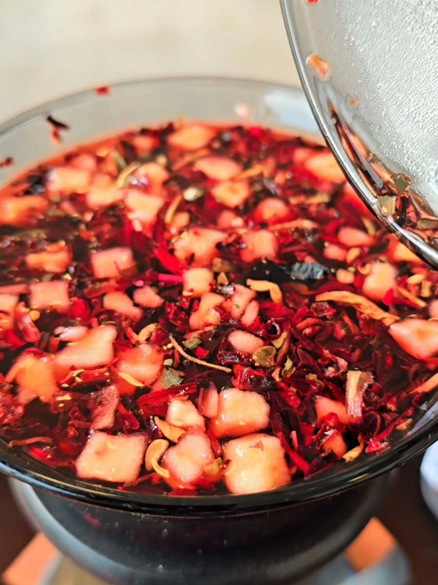 A post by @naturescrossing on TikTok caption: Herb if the week Hibiscus Make Tea with Me. Strawberry Hibiscus Tea #herboftheweekwithtammy #herboftheweek #womenownedbusiness #maketeawithme #naturescrossing #herbswithtammy  #herbs #tea #natureismymedicine #teawithtammy #doyourresearch #naturalhealing #maketeawithme 