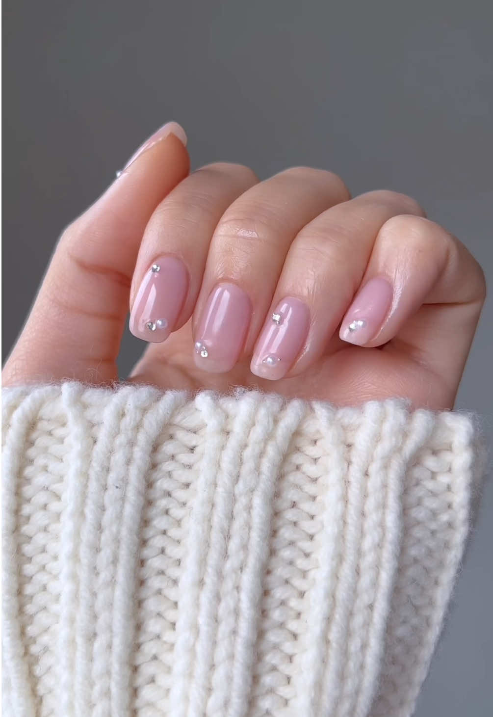 A post by @nailsbyalsn on TikTok caption: dainty gemstone nails inspired by my @Mejuri pieces 🦪🫧 Using @Le Mini Macaron  Blush Gel Shine Top Coat * discount code: ALISON15 @LOCCITANE hand cream *aff #mymejuri #mejuripartner #nailinspo #gelnails #nailinspo 