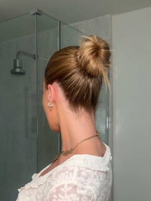 A post by @anggwells on TikTok caption: The perfect festival hairstyle inspired by @Becky G using @GarnierUSA fructis sleek + stay for extra shine and all day frizz protection 💚 #garnierpartner #slickbackbun #festivalhair #garnierhaircare #garniersleek  