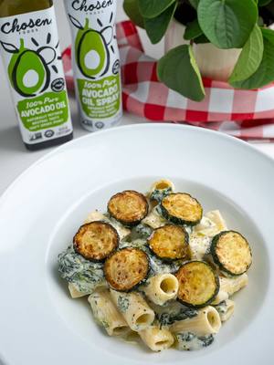 A post by @breadbakebeyond on TikTok caption: Ricotta & Spinach Rigatoni with Fried Zucchini This pasta is a signature dish in my home this season. The creamy, lemony ricotta sauce pairs perfectly with vibrant green spinach. Crispy fried zucchini adds texture and another layer of flavor - and to elevate it even more, I used avocado oil and spray by @Chosen Foods  Ingredients For the Ricotta Mixture: 15 oz ricotta 3 tbsp grated Parmesan Zest of 1 lemon 1 tsp black pepper 2 tbsp pasta water 1/2 lb rigatoni 3 sprays Chosen Foods Avocado Oil Cooking Spray 2 garlic cloves, minced 2 cups spinach, roughly chopped 1/4 cup grated Parmesan 1 cup pasta water (you might not need all of it) Salt, to taste For the fried zucchini: 2 zucchini, thinly sliced Chosen Foods Avocado Oil, for frying For Serving: Drizzle of extra virgin olive oil Extra grated Parmesan Freshly ground black pepper (optional) Instructions Heat avocado oil in a pan over medium heat. Add zucchini slices and fry until golden on both sides. Set aside on a paper towel-lined plate. Bring a large pot of water to a boil. Add 1/2 tablespoon salt and cook pasta until just under al dente (about 2 minutes less than package instructions). In a bowl, mix ricotta, salt, lemon zest, Parmesan, black pepper, and 2 tbsp pasta water until smooth. (For a silkier texture, blend using a food processor or hand mixer.) In a large pan over medium heat, spray avocado oil and sauté garlic for 30 seconds. Add spinach and 2 tbsp pasta water, and cook for 1-2 minutes until wilted and most of the water has evaporated. Add cooked pasta, ricotta mixture, and grated Parmesan. Stir in 4 tbsp pasta water and cook until the sauce is creamy and pasta is done. Add more pasta water if needed to loosen the sauce. Serve hot. Top with crispy zucchini, a drizzle of olive oil, black pepper (if using), and extra Parmesan. #chosenpartner  Creamy pasta recipe Easy dinner Ricotta spinach pasta Zucchini recipes Easy Recipe Comfort food