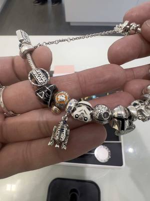 A post by @northoutletpandoralv on TikTok caption: Love her Star Wars Pandora collection #pandorastarwars #pandoracleaning #pandorajewelry #fyp #starwars #foryoupage 