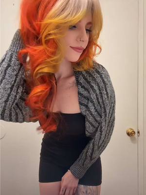 A post by @redwolfieee on TikTok caption: Okay @Lunar Tides I see you 👀colors used Siam orange + solar flare & fire opal on the bangs 🔥 Use code: redwolfieee15 for 15% off 🧡 #lunartideshair #hairtok #haircolor 