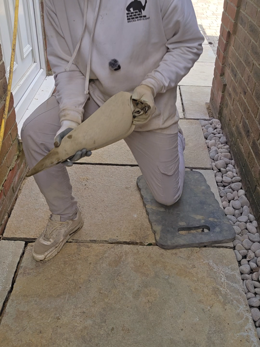 A post by @bricksandslides on TikTok caption: How the pros point the patios #foryou #bricklayer #bricklaying #garden #landscaper #landscape #fyp 