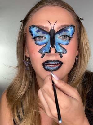 A post by @katiefarhood on TikTok caption: ib @Mei Pang 🦋 #butterflymakeup #artisticmakeup #stampmakeup #makeuptutorial #makeupchallenge  