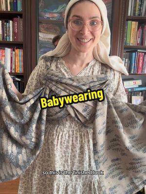 A post by @miriamezagui on TikTok caption: Babywearing with a woven wrap. This wrap is made of non-stretchy fabric. #babywearing #babywearingmama #wovenwrap #baby #momlife 