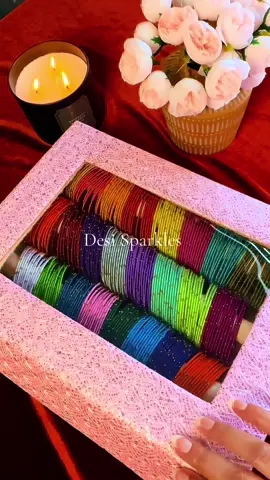 A post by @desi.sparkles on TikTok caption: 24 sets. 288 colorful bangles. One gorgeous box! Perfect for brides, events & glam collectors! $150 | DM to order | IG: @desisparkles