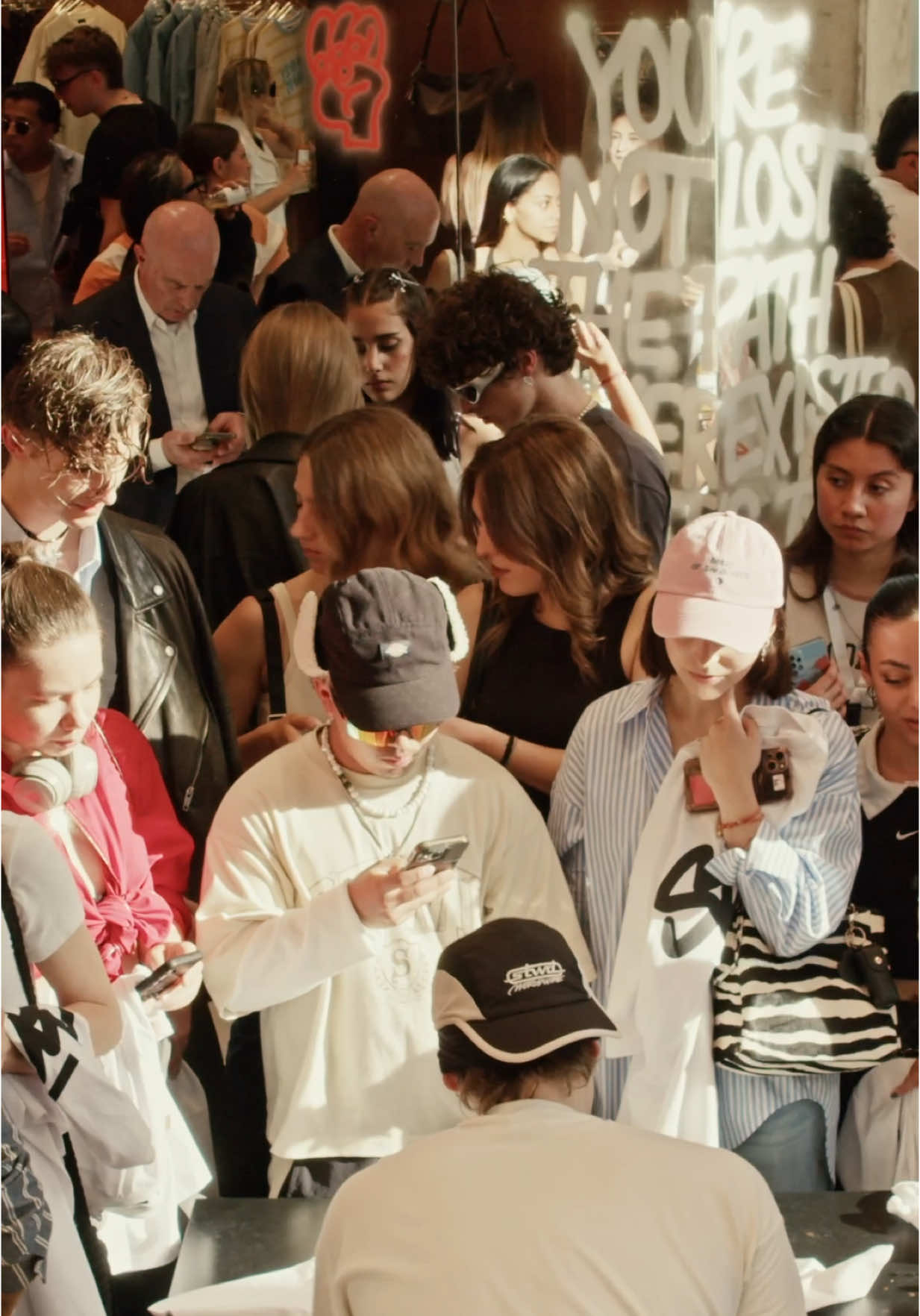 A post by @davidevavalaa on TikTok caption: hosting the event at the @Pull&Bear pop-up store in milano painting tees, meeting friends. thank you all x #stwd #adv