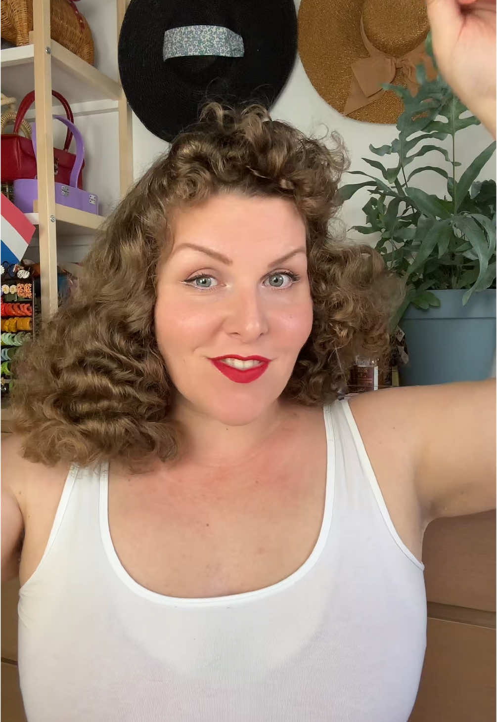 A post by @hollandschmeisje on TikTok caption: Brushout with middle part and fringe for a change. It’s giving spaniel ears 😂  #vintagehair #vintagestyle #1940sfashion 