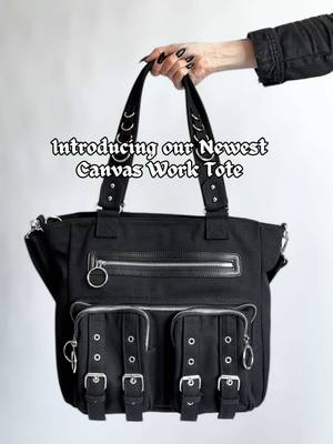 A post by @foxbloodshop on TikTok caption: Meet Jayce! Our NEW Canvas Work Tote 🖤 #gothtok #darkaesthetic #gothicstyle #darkacademia #workbag #fashionbag #mallgoth #bookbag #messengerbag #corporategoth 