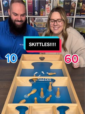 A post by @games4two on TikTok caption: How Does This Even Happen?! Come Play Skittles With Us! #boardgames #gamenight #couple #fun 
