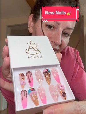 A post by @poopiblh on TikTok caption: Je mets les ongles personnalisés foodies qu’une petite mochi m’a fait 💅🍩🍦!! Et je vais tester les pads pour mettre ces press on nails de chez lysia.pressonnails ✨ #nails #ongles #beauty #pressonnails #personnalisation #nailart #foodies #donuts #icecream 