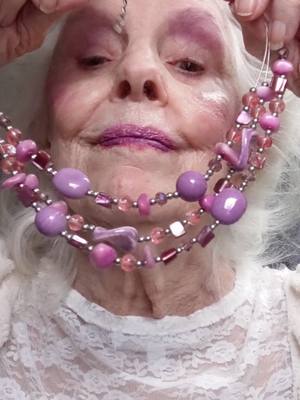 A post by @sassygrandmapat on TikTok caption: 🎀💜💕 enjoying lavender. lavender makeup, lavender accessories 