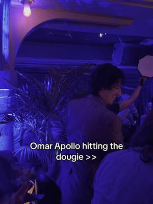 A post by @voguemagazine on TikTok caption: #OmarApollo, can you teach us how to dougie? The singer had all eyes on him last night as he showed off his dance moves at Vogue’s First Friday in May party. 
