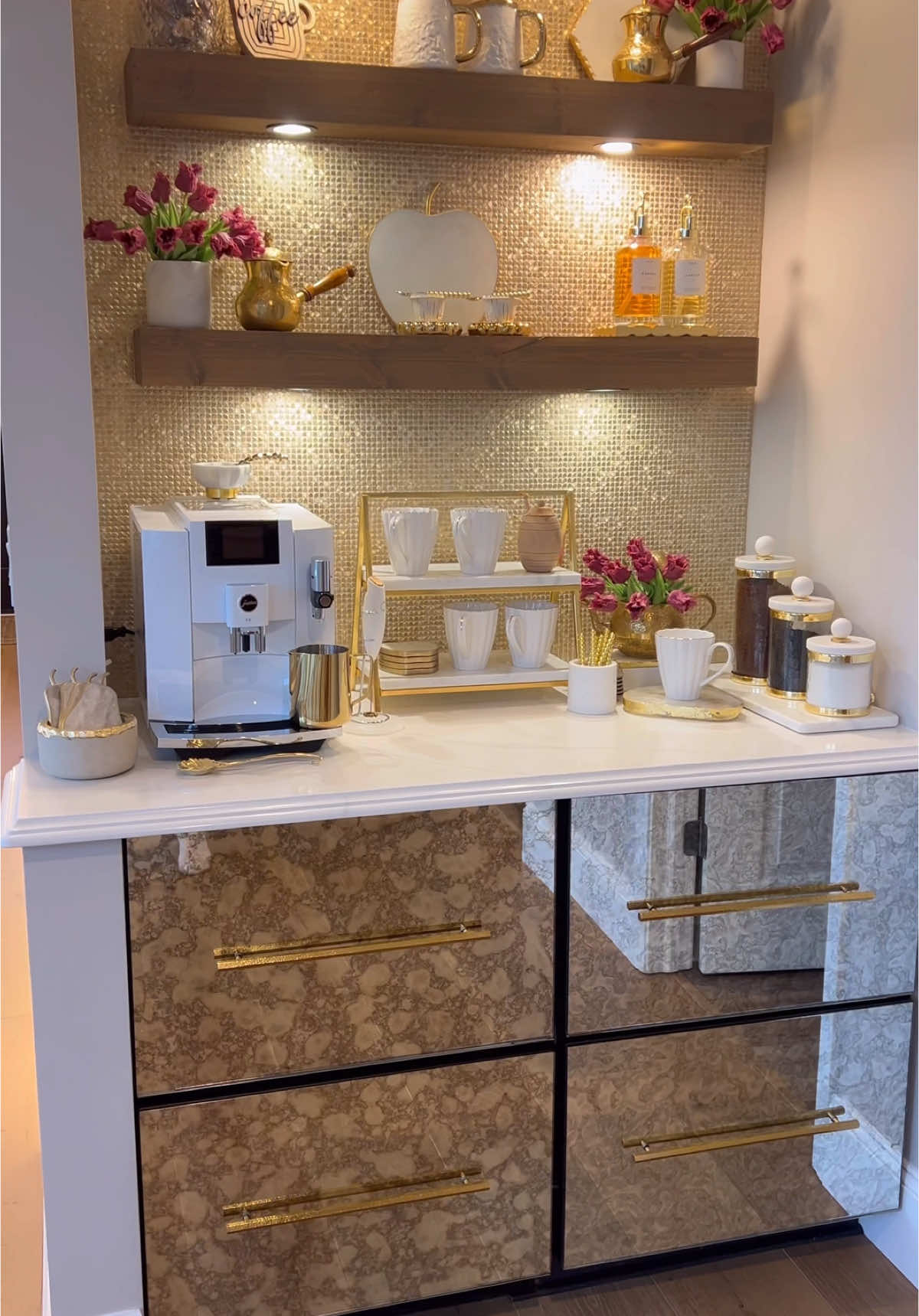 A post by @homewithfarah on TikTok caption: I had the urge to remove everything off my coffee station, clean and restyle this space for spring. Warmer weather but rainy day! Re styling this space makes it all feel new for me! I changed out the florals and used purple tulips for spring. I love how that pop of color made a difference in here! What do you think?