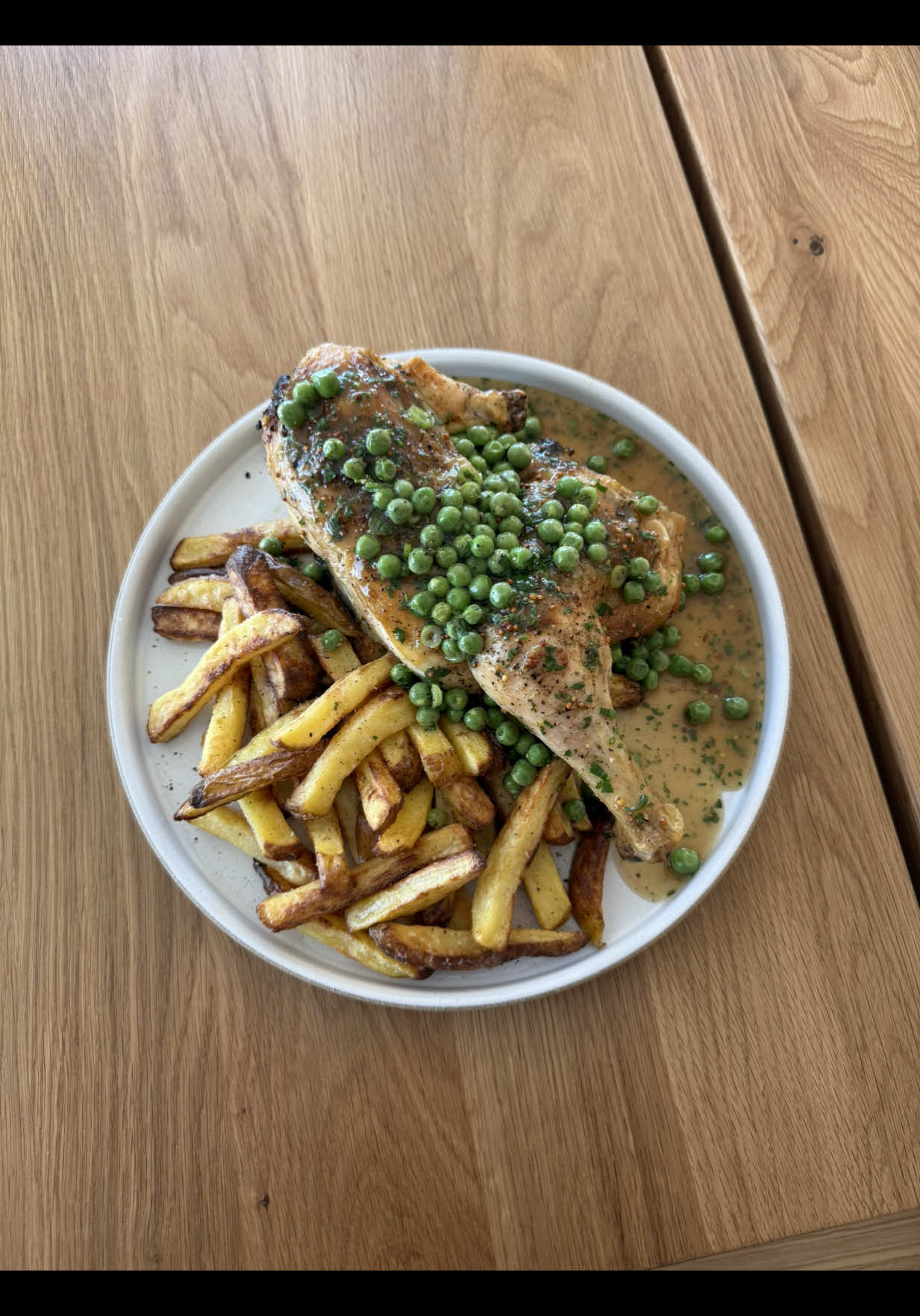 A post by @chuckischarles on TikTok caption: Roasted Chicken and Fries with a Sweet Pea and Mustard Sauce. All made in the @Breville Smart Oven Air Fryer Compact. I love how versatile it is being able to roast, bake, and air fry all in one machine. #breville #ad