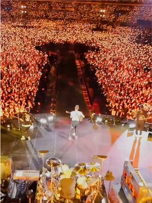 A post by @coldplay on TikTok caption: Seoul FPV 🇰🇷 #Coldplay #MusicOfTheSpheresWorldTour 