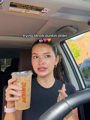 A post by @jade.amberrrrr on TikTok caption: trying a tiktok dunkin order 🥲 medium iced latte w/ oatmilk 2 shots blueberry 2 caramel swirl. comment your fave dunkin orders below!🤍