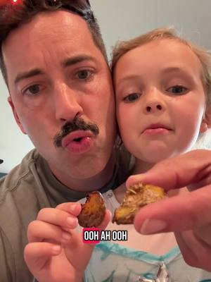 A post by @butterworthdasyrup on TikTok caption: Smashed Potatoes with my helper! Super easy fun recipe to do with kids.   Smashed Potatoes Boil potatoes Smash Brush olive oil on Season with rosemary, herbs of your choice, salt, garlic Bake on parchment paper at 450 for about 20 minutes #recipes #smashedpotatoes #cookingwithdad #family 