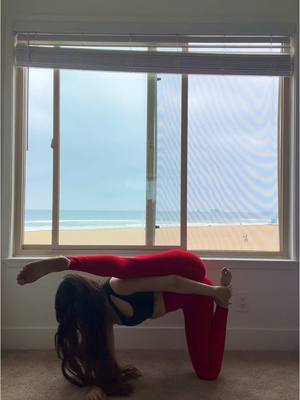 A post by @lauramejiayoga on TikTok caption: First time trying this pose ❤️☁️ #yoga #yogagirl #flexibility