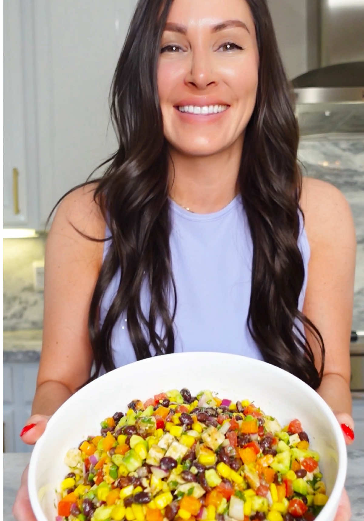 A post by @chefgenevieve on TikTok caption: Cowboy Caviar just got a smoky & sweet upgrade 🤠🔥🍗 Grilled BBQ chicken takes this viral dish to the next level with bold flavor and extra protein. Serve it with chips, lettuce cups, or as a hearty side - Save this for your next cookout or summer party. You’re gonna want seconds. Ingredients: 1 chicken breast 2 tsp chicken seasoning  2 tsp avocado oil  2 tbsp BBQ sauce 15oz can corn, drained  15oz can black beans, well rinsed  3 roma tomatoes, seeded and diced 1 orange bell pepper, seeded and diced  1/2 red onion, diced 1 jalapeño pepper, seeded and finely diced 2 avocados, diced 4 limes, juiced 1/2 bunch of cilantro, minced  1/3 cup avocado oil  2 garlic cloves, grated  2 tsp salt 1/2 tsp pepper  Directions: Pound chicken thin. Rub in seasoning and coat with oil. Add chicken to a preheated grill set to medium and cook about 4-6 minutes per side then coat with BBQ sauce. Allow to rest then cut into bite sized pieces.  Meanwhile to a bowl, add corn, rinsed black beans, tomatoes, bell pepper, red onion and jalepeno.  Dice avocados and stir with fresh lime juice then add to the bowl along with your chicken, cilantro, avocado oil, garlic and salt and pepper. Mix well. Serve with tortilla chips, on lettuce cups or as a side or a topping.  Enjoy! 🤠  #CowboyCaviar #BBQChicken #SummerRecipes #ViralRecipe #GrillSeason #HealthyRecipes
