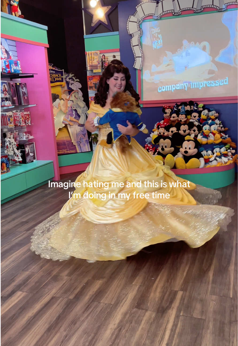 A post by @thedisneybelle on TikTok caption: Just a girl twirling in a 90’s Disney store… #cosplay #belle #princessbelle 
