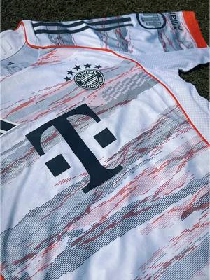 A post by @fcbayern on TikTok caption: Two decades of iconic memories. 🥹  The new #FCBayern 25/26 Away Jersey celebrating 20 years of the #AllianzArena  👉 Link in bio! #MiaSanMia #FCBayern #AllianzArena