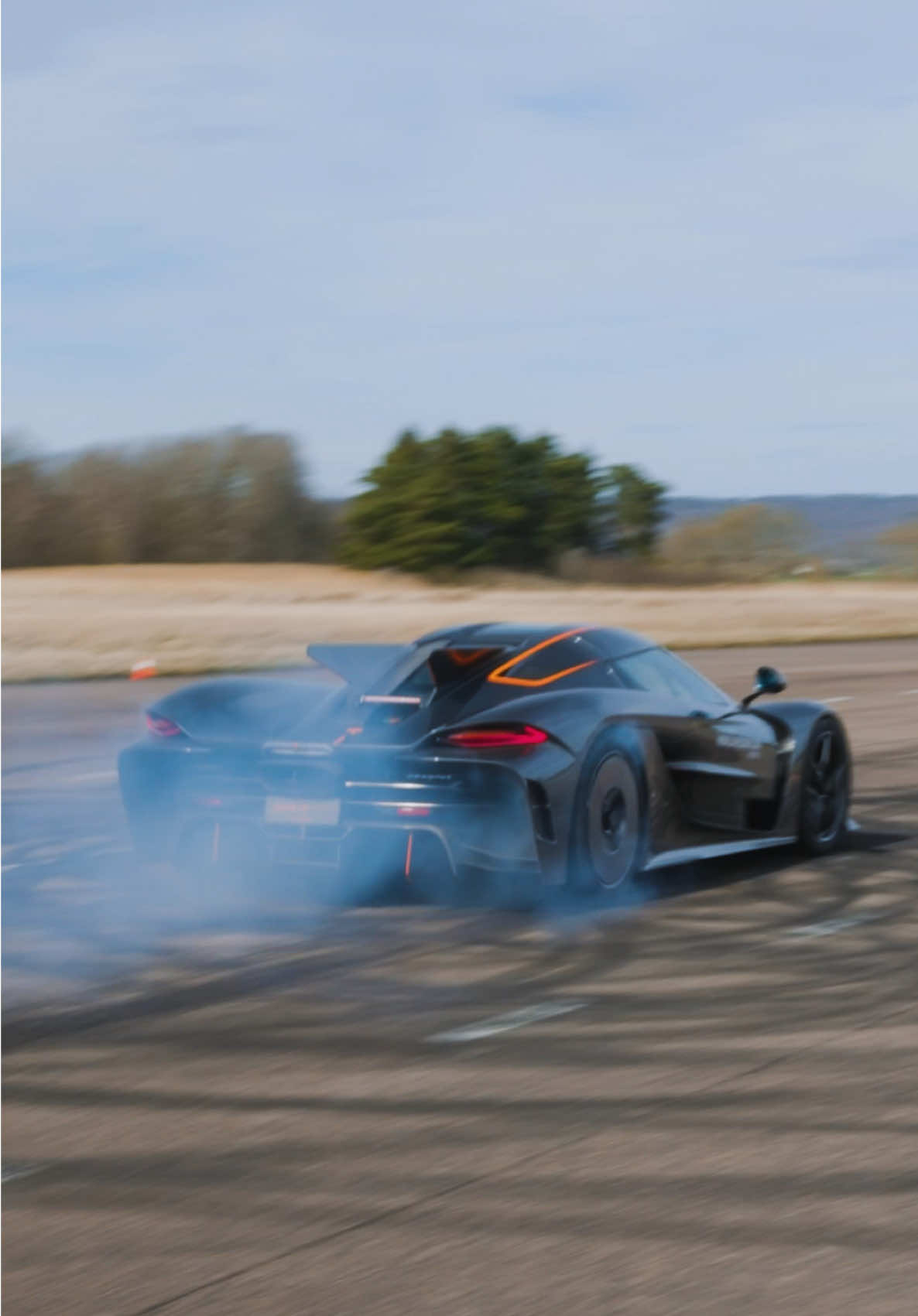 A post by @koenigsegg on TikTok caption: Absolut Madness - Having fun in our backyard - Casually setting new records! #Koenigsegg #Jesko #Absolut 